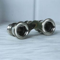 Antique nickel-finish pocket binoculars, showing a three-quarter angled view that highlights their classic design.