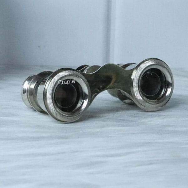 Nickel Finish Pocket Sized Antique Binoculars-3 Antique nickel-finish pocket binoculars, showing a three-quarter angled view that highlights their classic design.