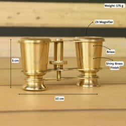 Product image of brass binoculars with labeled dimensions showing 10 cm width, 8 cm height, 175g weight, and 2X magnifier.