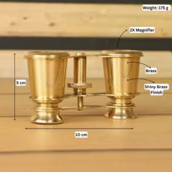 Product image of brass binoculars with labeled dimensions showing 10 cm width, 8 cm height, 175g weight, and 2X magnifier.