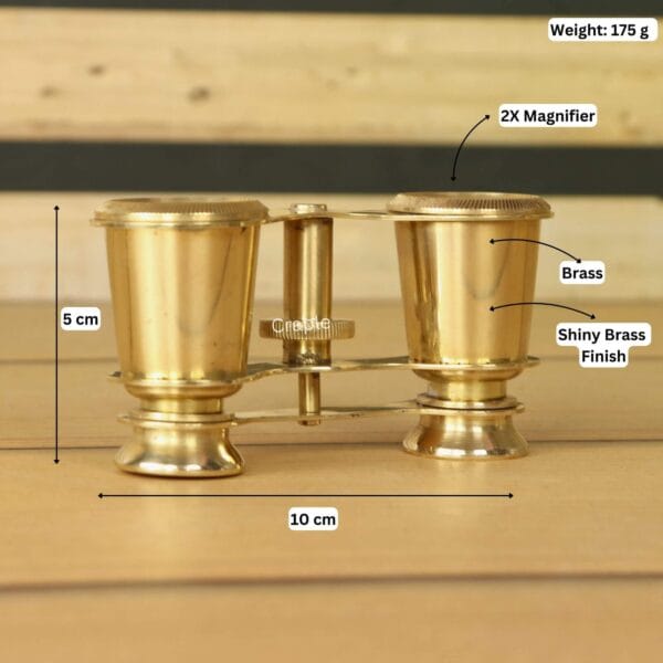 Shiny Brass Decorative Binoculars-6 Product image of brass binoculars with labeled dimensions showing 10 cm width, 8 cm height, 175g weight, and 2X magnifier.