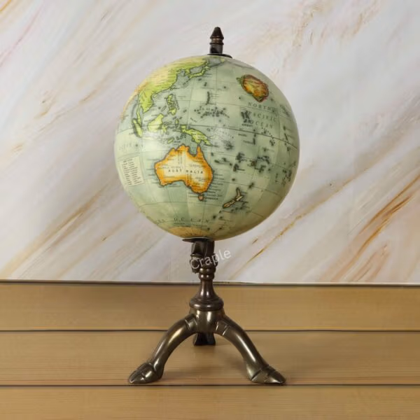Antique Brass Tripod World Globe-4 The decorative world globe showing a detailed map of North and South America on its brass stand.