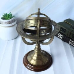 Centered view of the decorative armillary sphere focusing on the zodiac engravings on the brass rings.