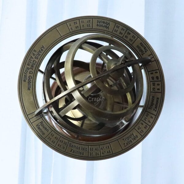 Top-down view of the brass armillary sphere highlighting the outermost zodiac ring and interlocking globes.