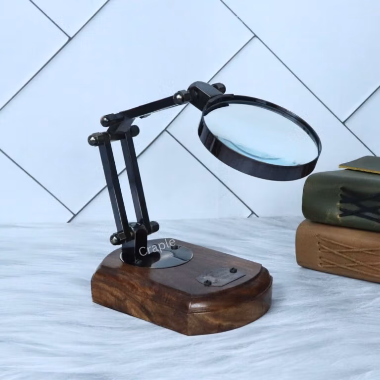 Elegant folding desk magnifier with a black antique finish and polished wood base, shown in a classic angled view.