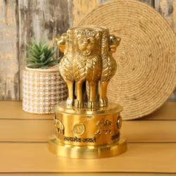 Brass Ashoka Stambh statue, the National Emblem of India, displayed on an office desk.