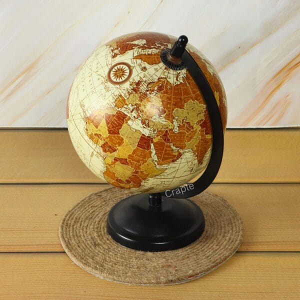 Brass Base Decorative World Globe-7 Side view of the vintage desktop globe, featuring its black semi-meridian arc and sturdy brass base.