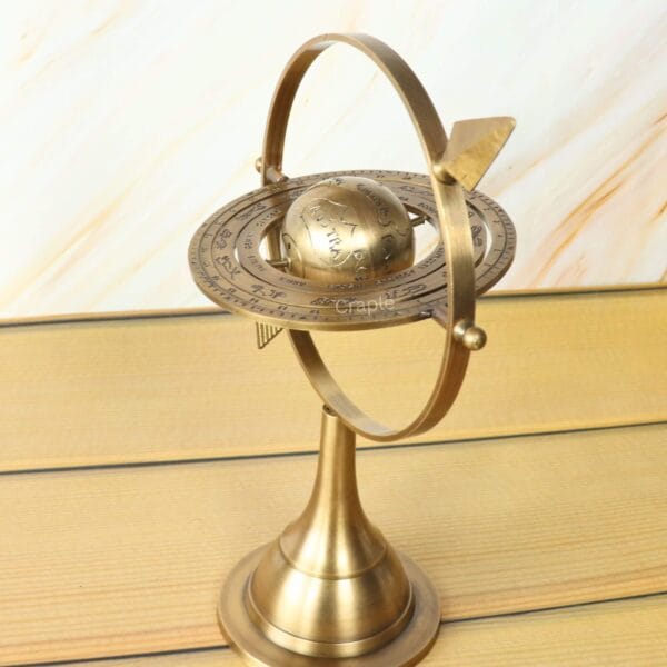 Top-down view of the brass armillary sphere showing the arrangement of the interlocking celestial rings.