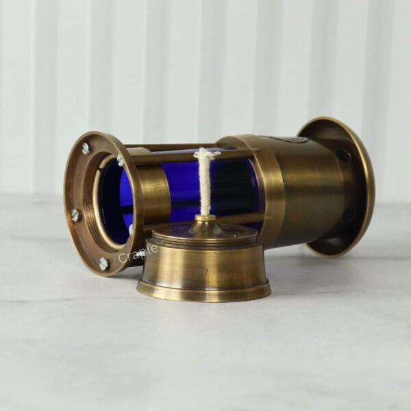 Brass Mariner’s Lantern-6 The nautical brass lantern lying on its side, showing the construction of the base and ventilation cap.