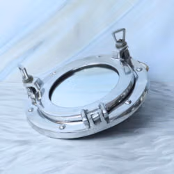 Angled side view of the nickel porthole mirror, detailing the sturdy hinge and closure mechanisms.