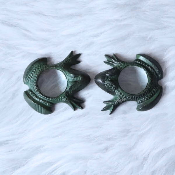 Frog Magnifying Glass-6 A pair of antique green brass frog magnifying glasses shown together from an angled view.