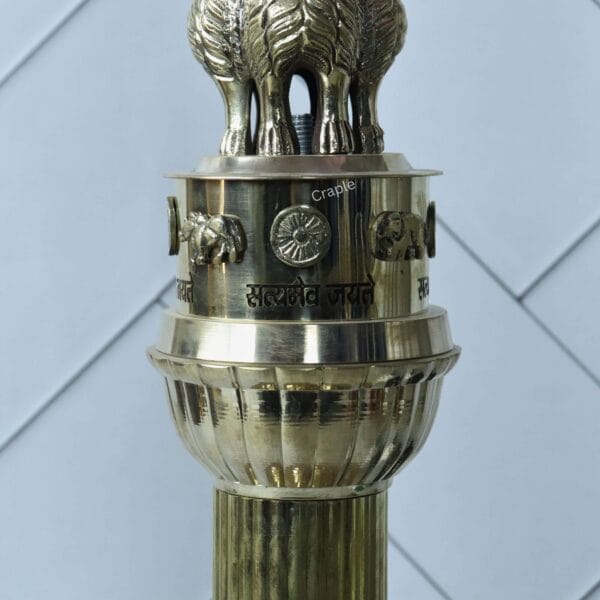 Detailed close-up of the abacus on the Ashoka Stambh sculpture, showing the national motto 'Satyameva Jayate'.