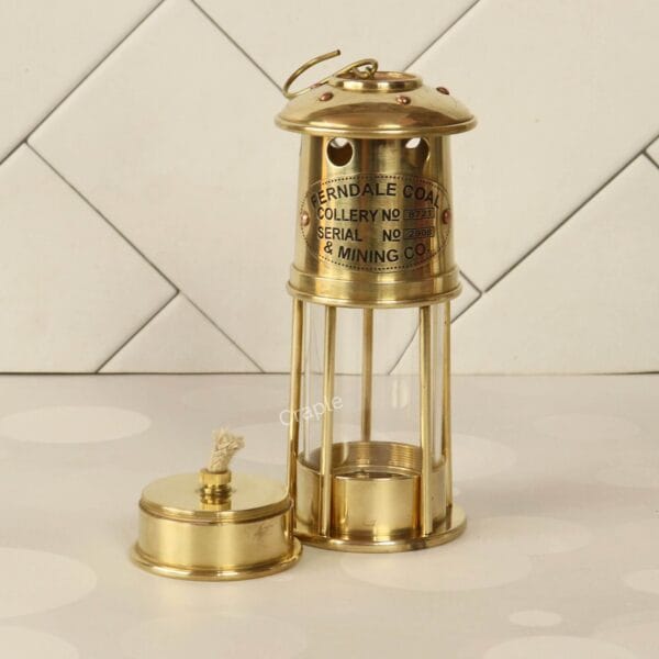 Handcrafted Antique Brass Miner’s Lantern-4 Side view of the antique brass lantern and its separate oil burner, showcasing the engraved plate.