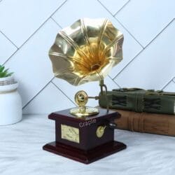 Front-angled view of the tabletop brass and wood gramophone display piece.