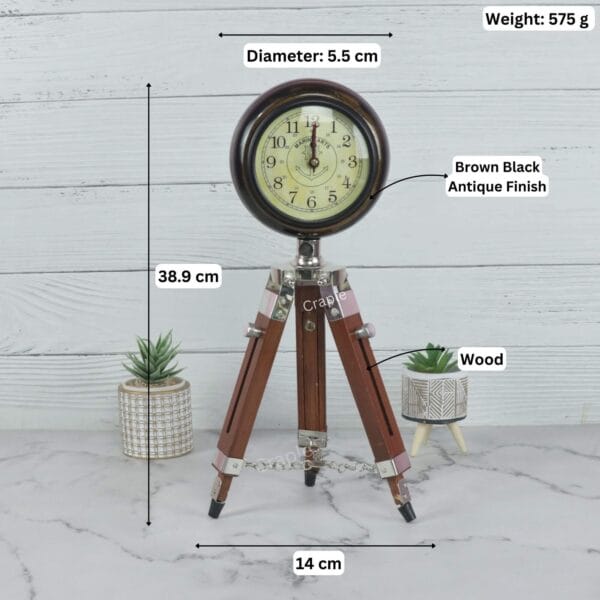 Product image of the tripod clock with labeled dimensions: 38.9 cm height, 14 cm width, and 575g weight.