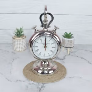 Front view of a vintage stopwatch-style hanging desk clock with a nickel finish, Roman numerals, and a sturdy base.