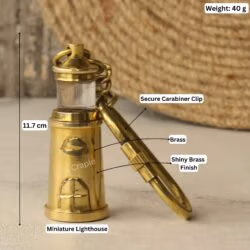 Brass lighthouse keychain with labeled dimensions: 11.7 cm length and 40g weight.