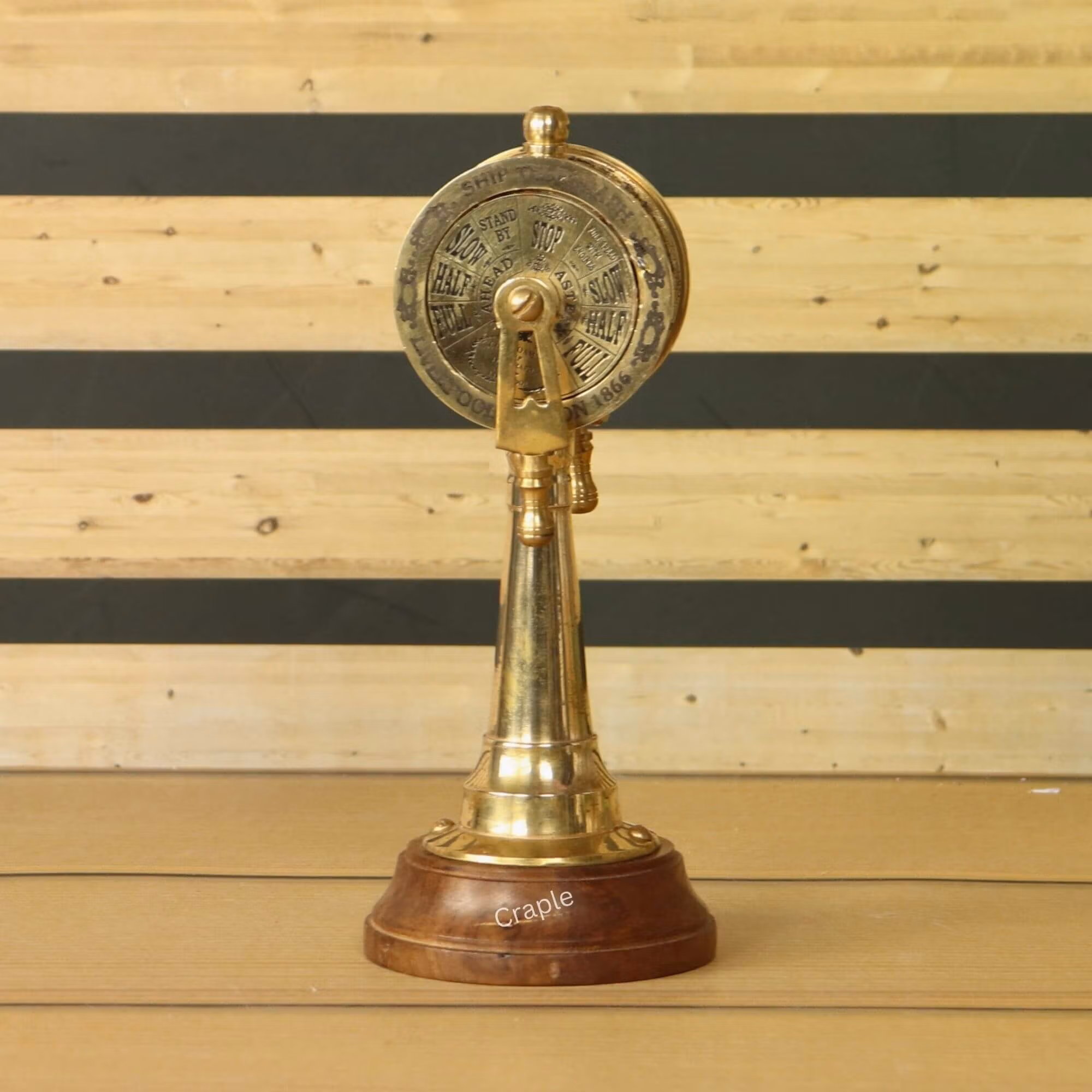 Main product image of a vintage-style brass ship's engine order telegraph with a wooden base, shown from the front.