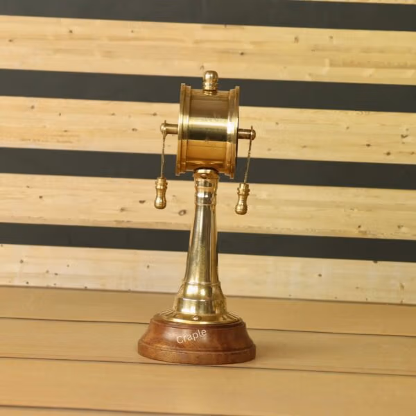 Side profile of the decorative brass ship's telegraph, showcasing its elegant shape and polished finish.