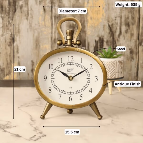 Image of the antique oval clock with labeled dimensions: 21 cm height, 15.5 cm width, and 635g weight.