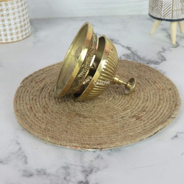 Service Desk Call Brass Bell-4 The brass reception bell tilted on its side, displaying the separate dome and engraved base.