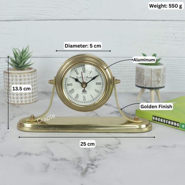 Product image of the golden desk clock with labeled dimensions: 25 cm width, 13.5 cm height, and 550g weight.