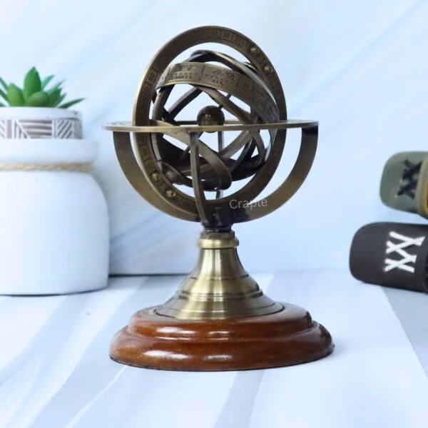 The brass celestial sphere used as a stylish decorative accessory for a nautical or vintage-themed room.