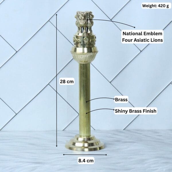 Image of the brass Ashoka Pillar with labeled dimensions: 28 cm height, 8.4 cm base width, and 420g weight.