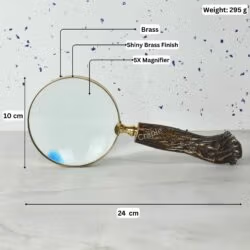 Image of the brass magnifier with labeled dimensions: 24 cm length, 10 cm lens diameter, 295g weight, and 5X magnification.