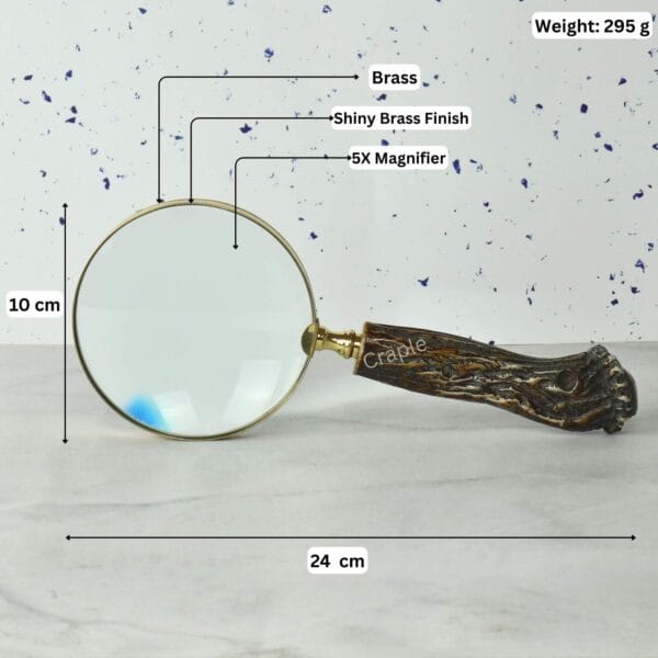 Image of the brass magnifier with labeled dimensions: 24 cm length, 10 cm lens diameter, 295g weight, and 5X magnification.