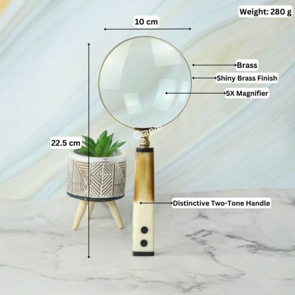 Image of the domino-handle magnifier with labeled dimensions: 22.5 cm length, 10 cm lens diameter, 280g weight, and 5X magnification.