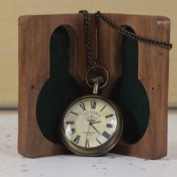 The Victoria London pocket watch displayed hanging on a handsome wooden and felt presentation stand.