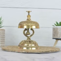 Side view of the vintage brass service bell, showcasing its ornate stand and polished golden finish.