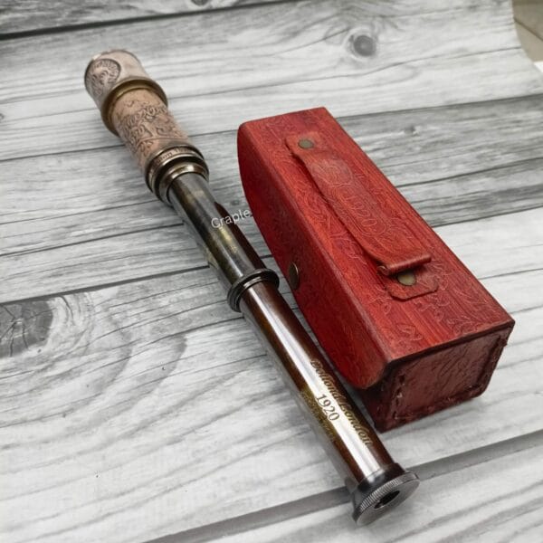 The 16.3-inch brass telescope fully extended to its maximum length, showing all three barrels.