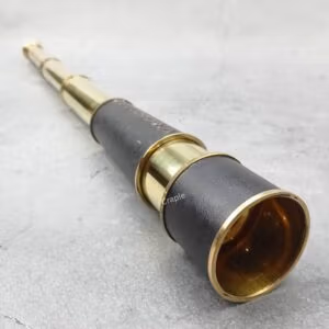Vintage nautical telescope with a leather-wrapped body and a shiny brass finish, shown fully extended.
