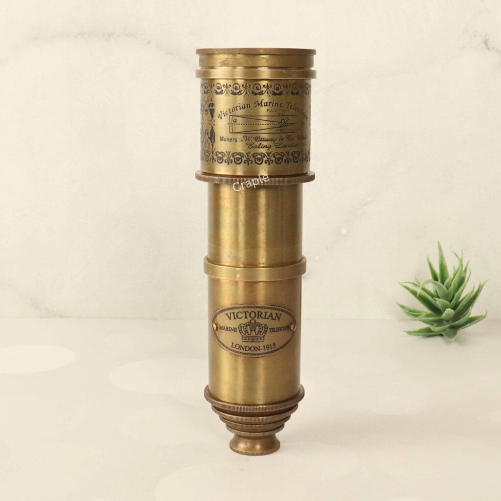 Vintage Victorian marine telescope made from antique brass, shown fully collapsed to highlight its decorative engravings.