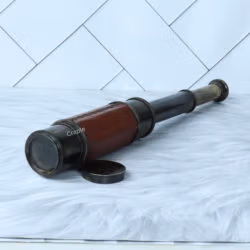 A leather-wrapped W. Ottway 1915 replica spyglass, partially extended to show its brass sections, with the lens cap nearby.