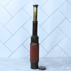 The W. Ottway replica telescope shown fully extended, displaying all of its polished brass sections.