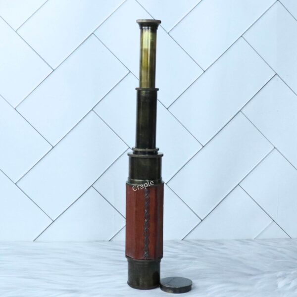 The W. Ottway replica telescope shown fully extended, displaying all of its polished brass sections.