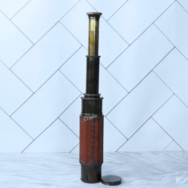 The W. Ottway replica telescope shown fully extended, displaying all of its polished brass sections.