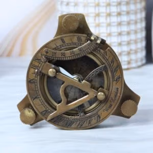 Antique brass sundial compass with a vintage finish, featuring an adjustable sundial gnomon and Roman numerals.