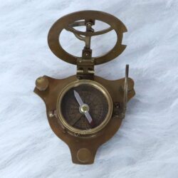 The base of the sundial instrument showing the integrated magnetic pocket compass with a directional needle.