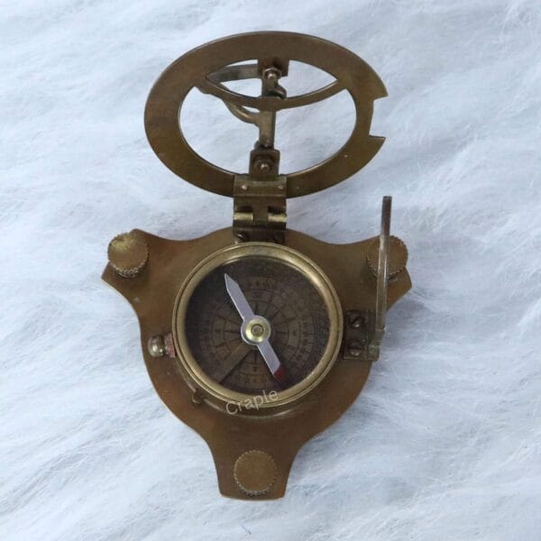 The base of the sundial instrument showing the integrated magnetic pocket compass with a directional needle.