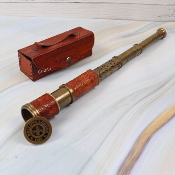 Vintage Dollond London 1920 replica brass telescope, fully extended, displayed with its protective leather case.