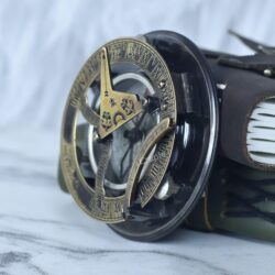 Rear angled view of the brass and silver navigational sundial compass, highlighting its sturdy build.