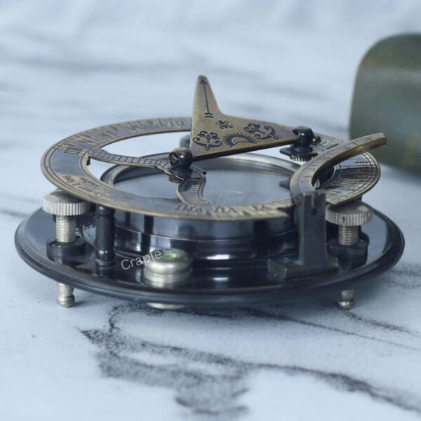 Antique Brass-Silver Sundial Compass-7 Low-angle side view of the antique brass and silver sundial, focusing on the adjustable leveling screws.