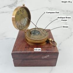 Antique brass sundial compass on its box with labeled dimensions, showing a 4.5 cm width and 95g weight.