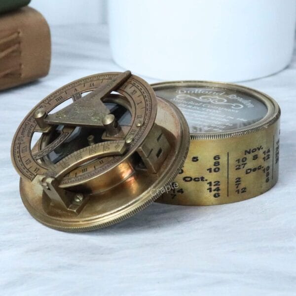 Antique Brass Sundial Compass-1 Antique brass Dollond London sundial compass with its engraved lid open, showing the internal sundial and compass.
