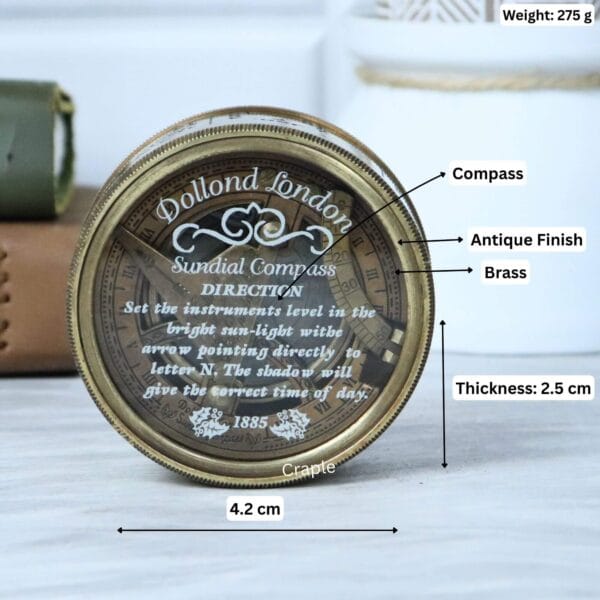 Brass sundial compass with its specifications labeled: 4.2 cm diameter, 2.5 cm thickness, and 275 g weight.