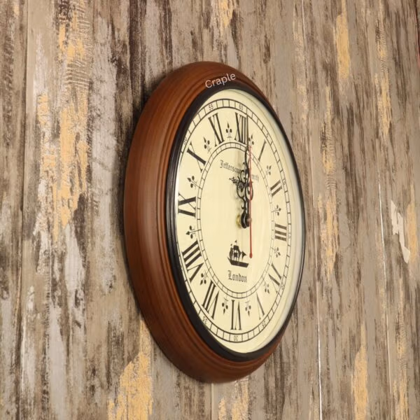 Angled view of the decorative wooden wall clock, showing the depth and smooth finish of its brown frame.